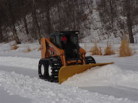 track skid steer snow traction